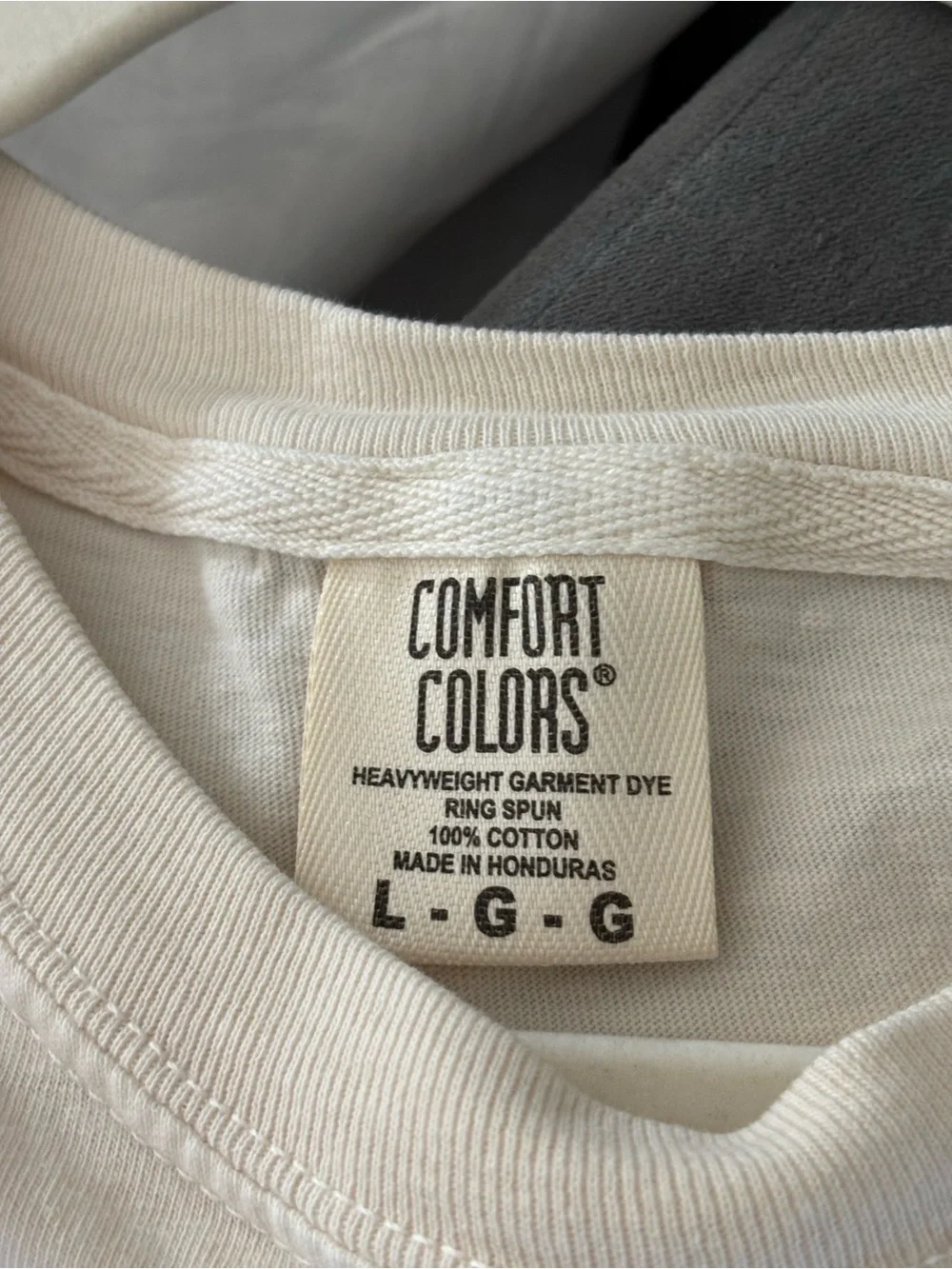 Comfort Colors Cream Short Sleeve Tee with Smiling Earth Graphic
